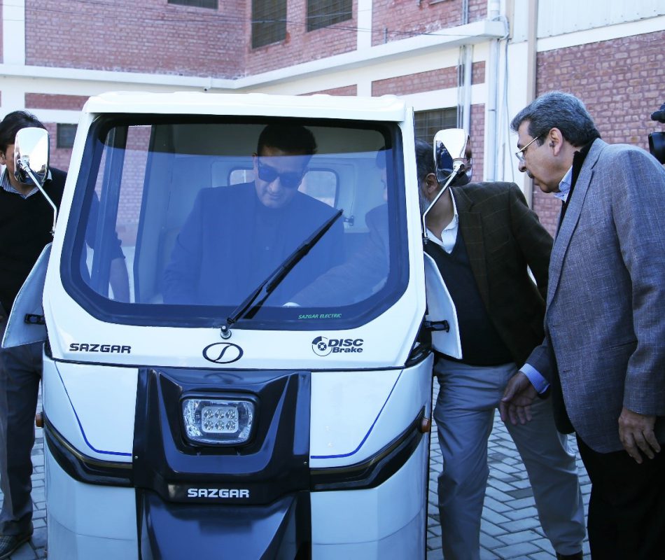 Malik Amin Aslam (advisor to Prime Minister for climate change of Pakistan) reviewing eVe the electric rickshaw